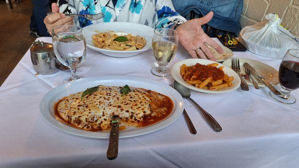 Rigatoni in vodka sauce and veal parmigiana with a side dish of penne in home-made marinara