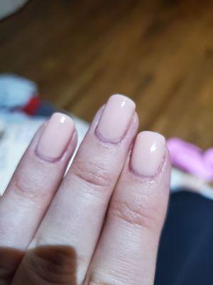 Uneven paint job, really poorly done especially near the cuticle. And this is what I left with after I pointed out the bad paint. :-(