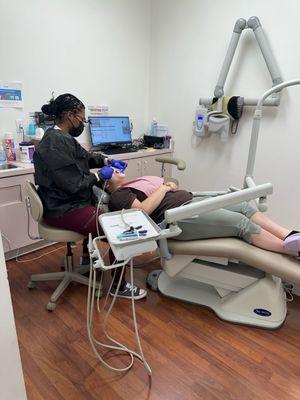 Hygienist giving my daughter her cleaning.