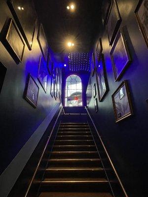 Stairway from entrance with celebrity pictures on the walls