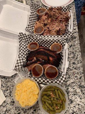 Brisket, pulled pork, green beans, Mac n cheese (we devoured the egg rolls)