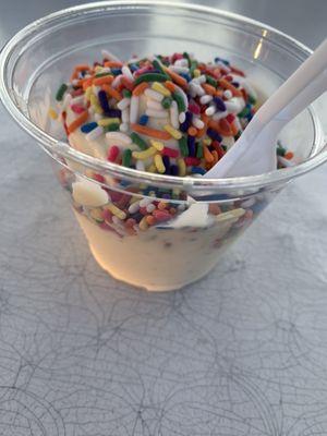 Peach gelato with rainbow sprinkles