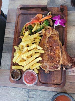 T-bone steak and fries