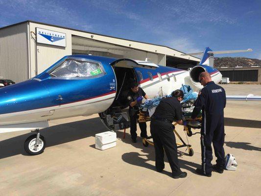 Aeromedevac Air Ambulance team assisting a patient