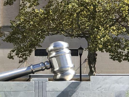 Huge gavel sculpture near courthouse