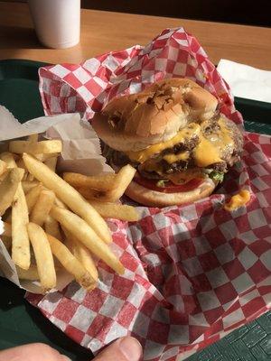 Triple meat burger and fries.