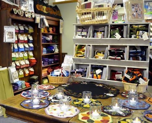 An adorable, sample-filled spread of wool candlemats lives off the elevator. The 100% wool section's in the background.