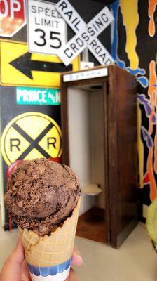 Chocolate ice cream in a waffle cone