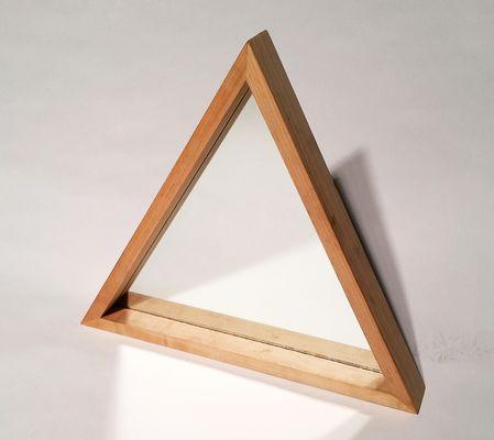 We're inspired by geometry. A maple framed mirror.