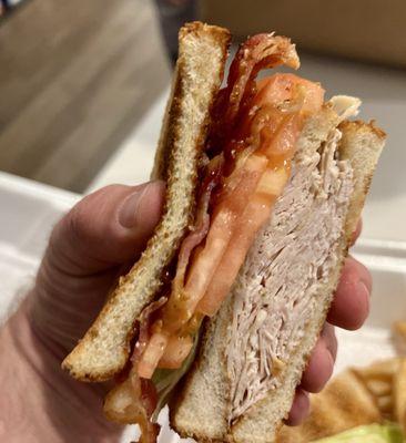 Somehow the tomato couldn't even add any juiciness to the Turkey Club Sandwich.