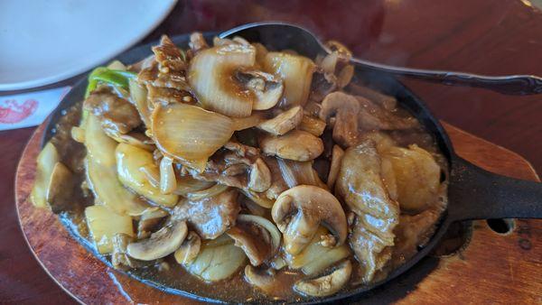 Sizzling Beef & Scallops after it cooked on the iron plate.