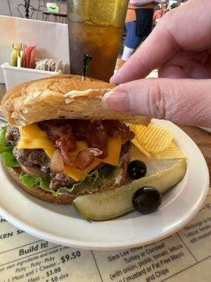 Bacon Cheese Burger, Pickle Spear, Garlic Olives, Potato Chips & Sweet Iced Tea with Lemon.