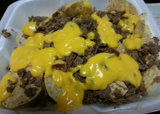 Cheesesteak Nachos, might as well get them in a to go container cause you won't finish them in one sitting.