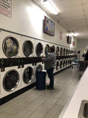 Dryers on the other wall of the room.