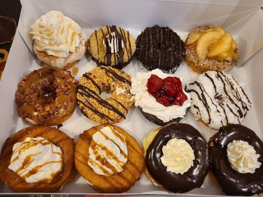 French toast, smore, chocolate cookie, apple crumb, maple bacon, samoas, strawberry cheesecake, lemon coconut, churros, Boston