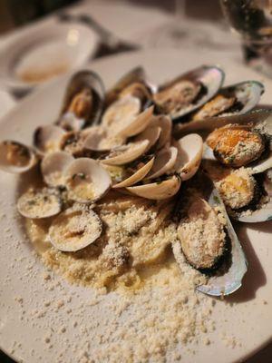 Clams and muscles over linguini.