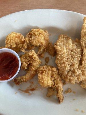 4 fried shrimp and a fried fish filet. Piping hot. My half of the dinner.