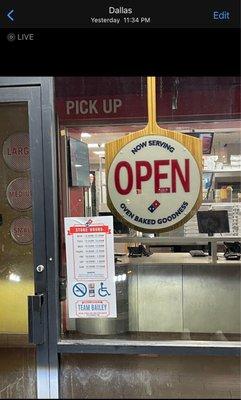 The sign with the store hours and saying they are open until 12. Plus you can see the date stamp on the picture.