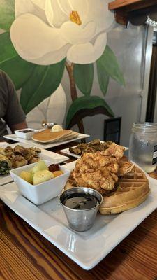 Chicken and Waffles and a side of fruit.