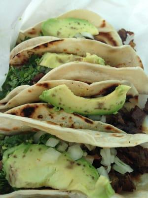 Lunch combo - four fajita tacos with a side charro beans.