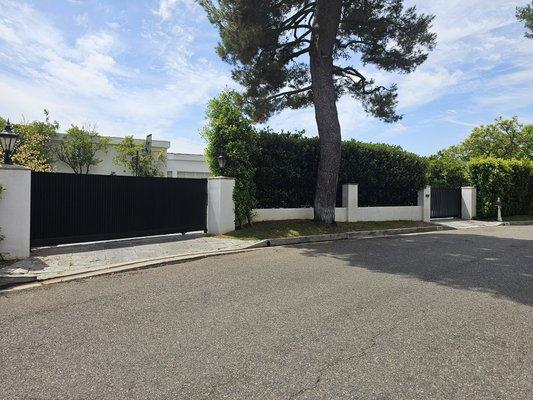 New modern vertical slanted slat wrought iron gates and openers project in Beverly Hills