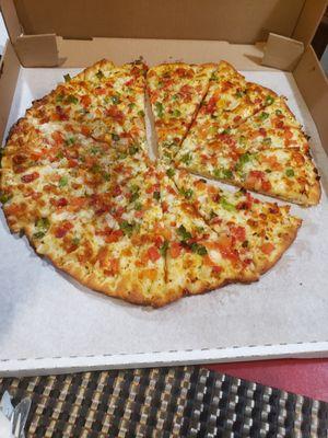 White Bianca sauce pizza either tomatoes, green peppers and roasted red peppers