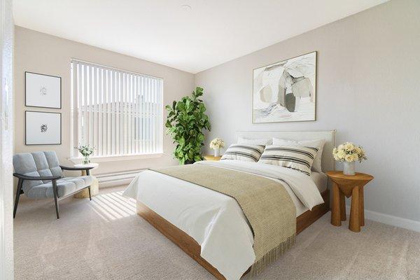 Spacious bedroom featuring a large window and carpeted floors.