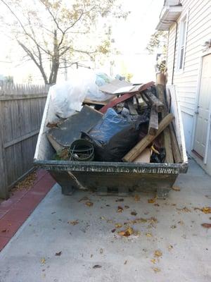 Dumpster dropped off and picked up in my narrow driveway. This was a 10 yarder.