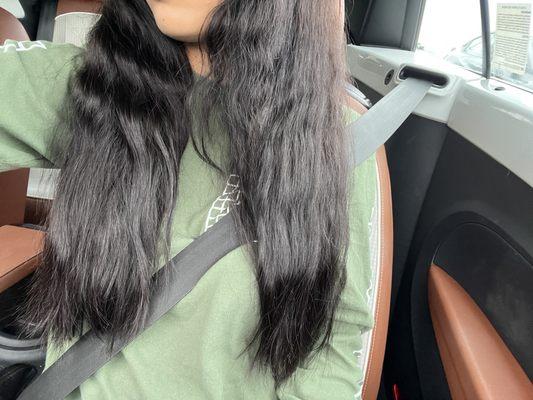 Hair is frizzy and wavy/curly on top and more straight on the bottom.