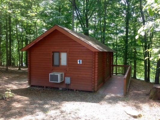 Front view of cabins, Mayo Lake in the distance.