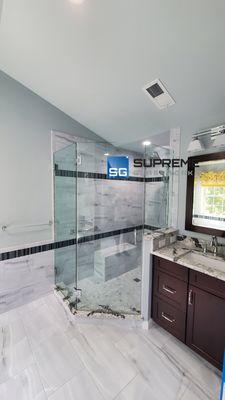 Neo-Angle frameless shower door. Cleae tempered glass. Polished chrome hardware.