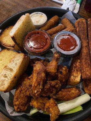 Appetizer Sampler. Wings, chicken strips, mozzarella sticks, eggplant sticks and garlic bread. It'a a delicious meal by itself!