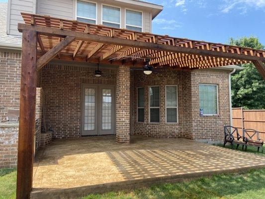 Cedar pergola with fan installed, stamped & stained concrete