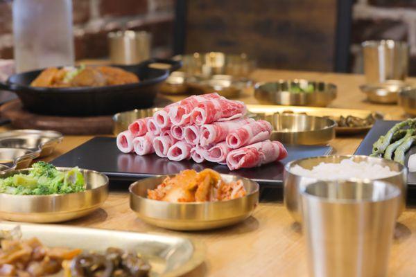 Chadolbaki (Thinly sliced fatty beef brisket) with special house made Banchan (side dishes)