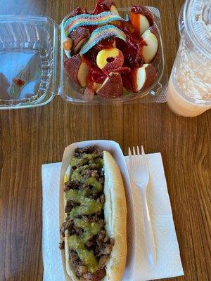 Hot dog with fajita and salsa verde on top. Agua Fresca de melon. Manzana loca