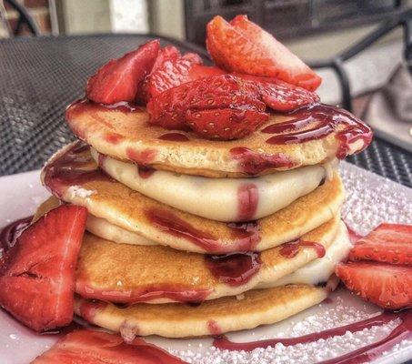 Silver Dollar Short Stack with Strawberries, Cannoli Cream, and Raspberry Drizzle!