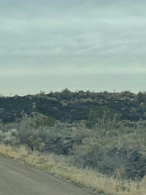 Volcanic rock coming into town. Thick layers.