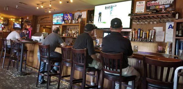 The "bar" seats 10.  But you can watch sports on TVs anywhere you sit.