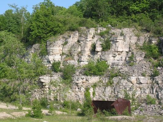 Some old equipment remains on the floor of the quarry.