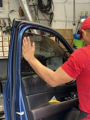 One of our window tint installer with 16 years of experience on a suburu Ascent