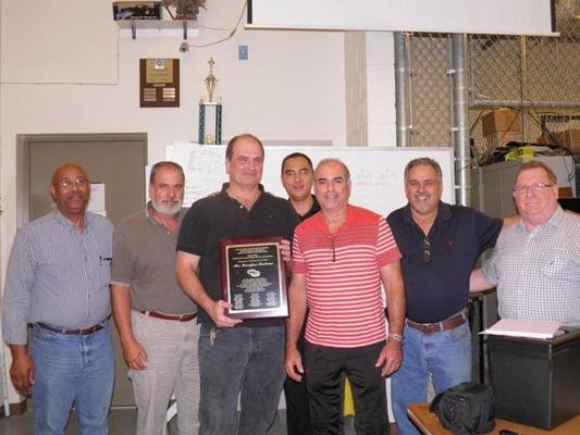 Doug receiving the Miami Dade County Public School Automotive Council Award!