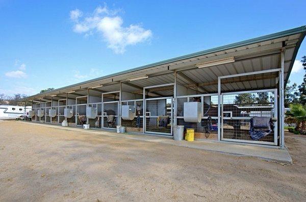 Shed row stalls 12 by 16 fully matted and mesh fenced