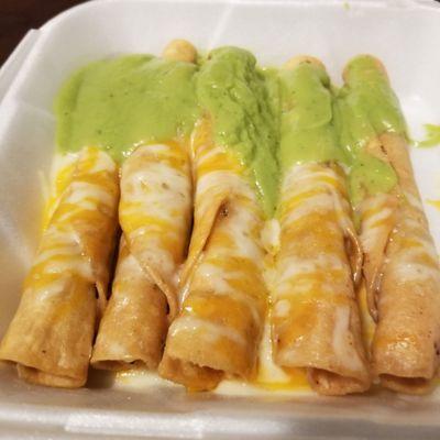 5 rolled tacos with cheese and liquid "guac"