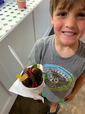 Yummy chocolate snow cone with gummy worms!