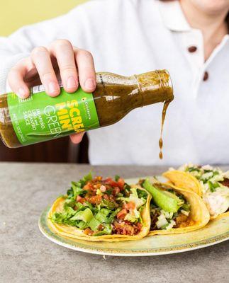 Screamin' Green hot sauce on tacos