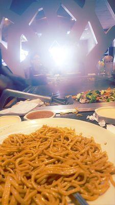 Noodles, and the chef is cooking the vegetables.