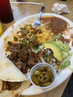 Bistek a la parilla with beans, rice, avocado , lettuce, pico de gallo, and cactus so good