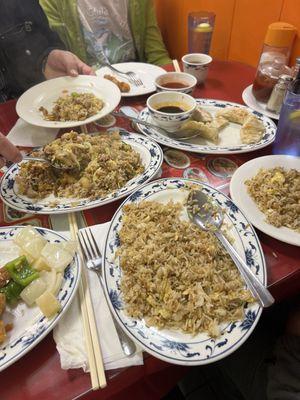 Combo fried rice, sweet and sour chicken, steamed dumplings, plain fried rice, and genera tso chicken.