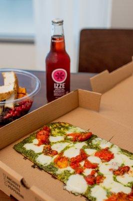 Margherita Flatbread; Oven-Roasted Tomato, Fresh Mozzarella, Arugula, Pesto, Fresh Basil, Evoo