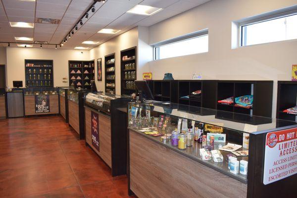 A photo of the interior of the store, showing several of the shelves and display cases.